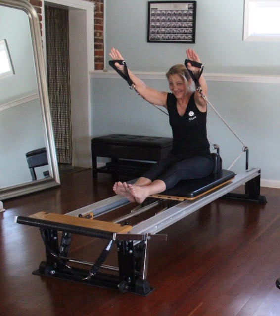 Pilates Student on Reformer in Superman Pose